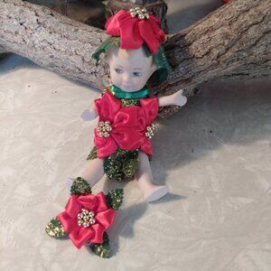 Marie Osmond Poinsettia porcelain doll from the "Flower Babies" collection